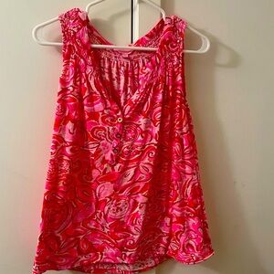 Lilly P.   Cute summer top. Pinks